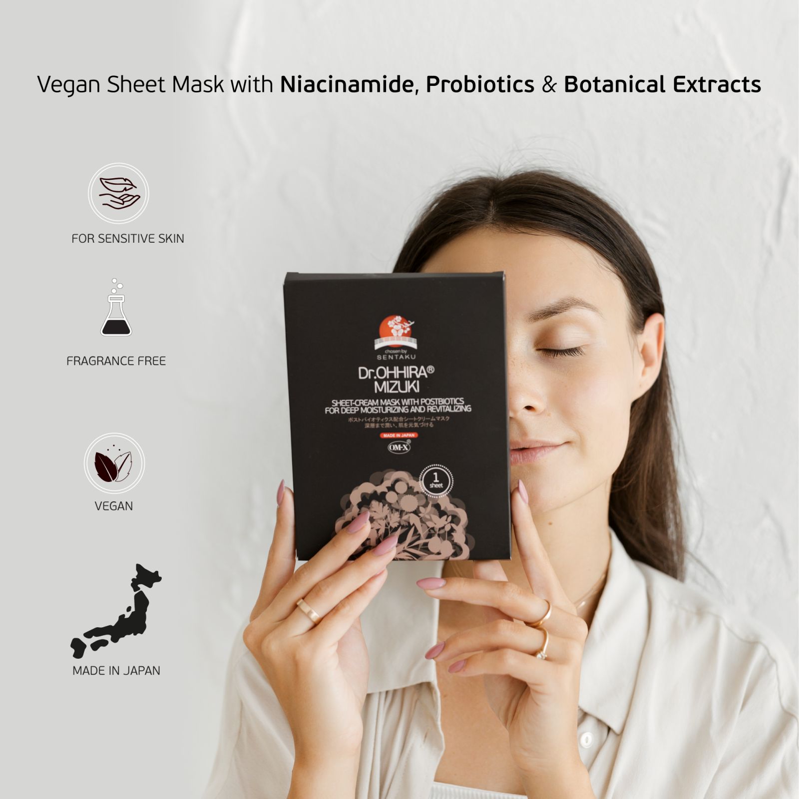 A woman holding a Dr. Ohhira MIZUKI sheet mask pack